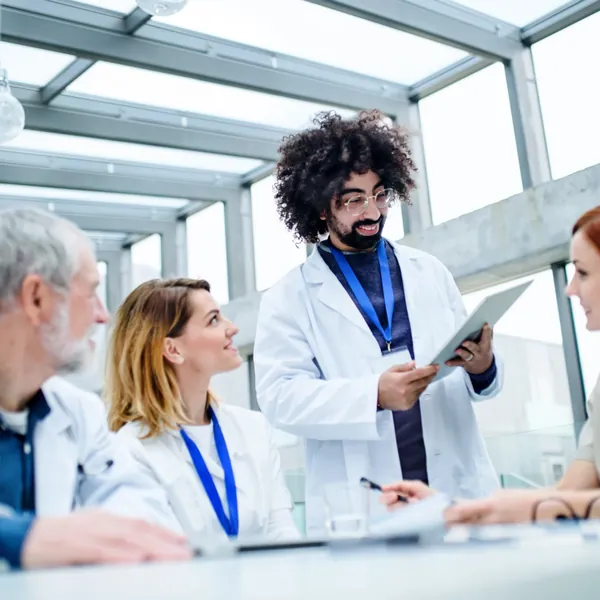 Doctors with a tablet at a conference