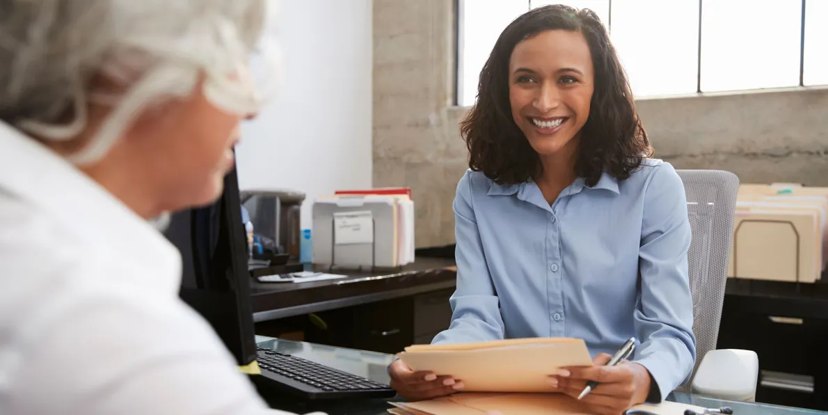 A doctor in consultation with a senior woman